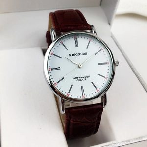 Classic men's quartz watch with silver steel case, roman numerals, and brown leather strap