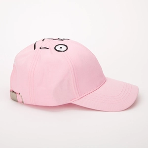 Close-up of pink cotton baseball cap with cartoon face embroidery and metal buckle