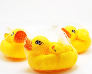 Three sets of classic yellow squeaky bath ducks in white mesh bags for safe baby bathing