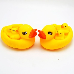 Yellow rubber duck family bath toy set featuring a large duck carrying three ducklings