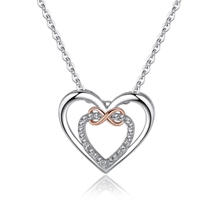 Detail of silver heart necklace with rose gold infinity symbol and diamond inlay