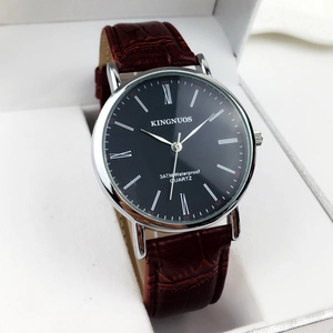 Classic men's quartz watch with black Roman numeral dial and brown leather strap in a gift box