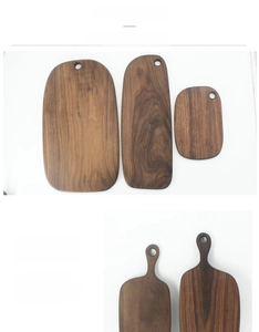 Macro detail of natural black walnut wood grain on cutting boards with hanging holes