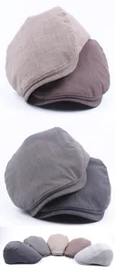 Assorted vintage plaid flat caps in vintage plaid patterns showing British style fabric variety