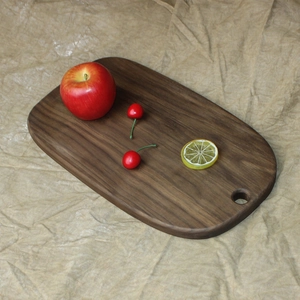 Solid black walnut wood bread board with handle and hanging hole for kitchen