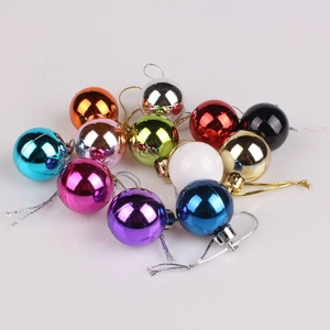 Macro shot of 3cm assorted colorful glossy Christmas tree ball ornaments with gold strings