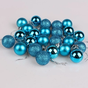 Close-up of blue Christmas baubles in glossy, matte, and glitter textures for tree decor
