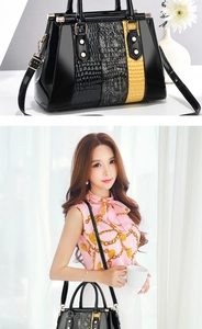Detail of color-block crocodile pattern handbag with gold hardware and shoulder strap