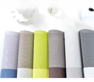 Detail showing the woven texture of durable PVC placemats in multiple color options
