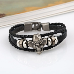 Braided black leather bracelet with metal skull charm and cowboy hat for men