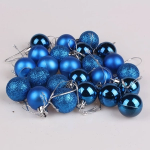 Close-up of blue Christmas ball ornaments in shiny matte and glitter finishes with hooks
