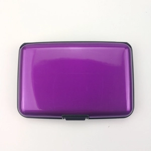 Top view of a purple metallic card holder with a secure black push-button closure