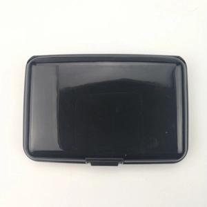 Close-up of a black glossy RFID blocking aluminum wallet with a secure snap closure