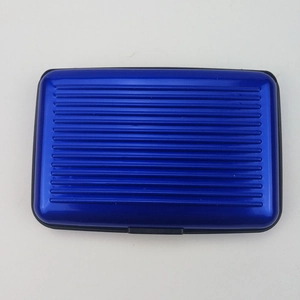 Top view of blue aluminum card holder featuring a sleek ribbed design and secure black clasp