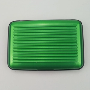 Green aluminum card holder featuring anti-magnetic RFID protection and grooved surface