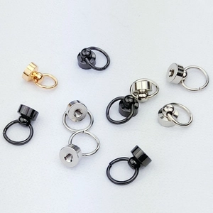 Macro shot of metal ring screw connectors for DIY phone case straps in four colors