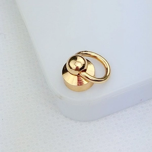 Macro shot of gold metal ring screw attachment for DIY phone case charm making