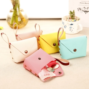 Detailed macro view of macaron colored PU leather coin purses with vintage bronze snaps