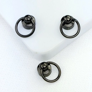 Macro view of three dark metallic screw ring connectors for DIY phone case straps