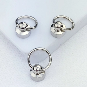 Macro shot of three silver metal ring screw studs for DIY phone case hand chains