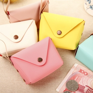 Macro detail of macaron colored PU leather coin purses with metallic snap fasteners