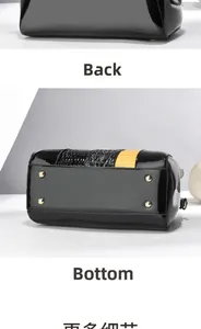 Detailansicht der schwarzen Lackhandtasche mit Krokodilmuster und schützenden goldenen Nieten