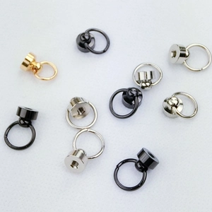 Macro detail of metal screw ring buckles for DIY phone cases in gold silver and black