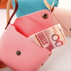 Detail of candy-colored mini coin purse showing inner space and snap button closure