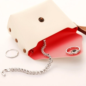 Silver tennis bracelet and diamond ring set with elegant leather jewelry pouch