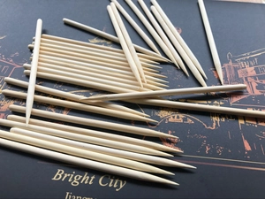 Macro shot of natural pointed wooden sticks for nail art and precision cleaning