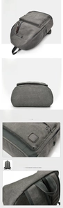Detail view of reinforced stitching and durable canvas texture on grey backpack