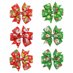 Detailed grid of Christmas ribbon hair clips with snowman and snowflake prints