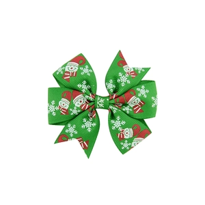 Detail of Christmas green grosgrain ribbon hair clip with snowman and snowflake prints