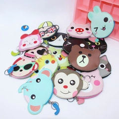 Colección de monederos y llaveros de silicona con caras de animales para niños.