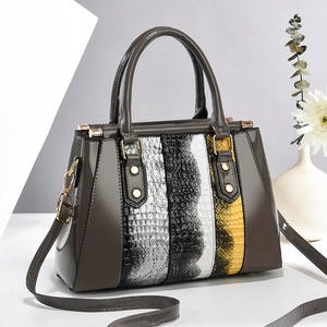 Fashionable patchwork crocodile pattern handbag with spacious interior and crossbody strap