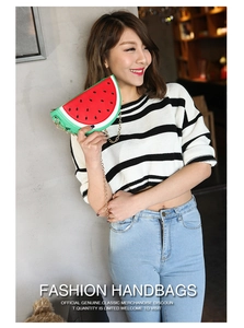 Fashionable watermelon shaped crossbody bag with gold chain strap shown by a model
