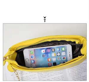 Fashionable lemon yellow fruit chain crossbody bag with internal phone storage and gold strap