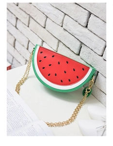 Detail shot of watermelon shaped chain bag with red PU leather and gold chain strap