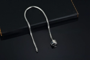 Detail view of 316L stainless steel snake chain with a cylindrical mechanical clasp