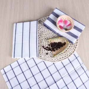 Japanese style cotton linen napkins with blue stripes and checks on wooden table