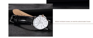 Detailed macro shot of the waterproof crown and black leather strap on a quartz watch