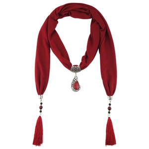 Detail of red tassel scarf necklace with ethnic peacock pendant and ceramic beads
