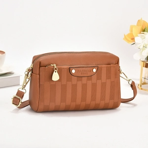 Brown textured leather crossbody bag with striped embossing and gold hardware