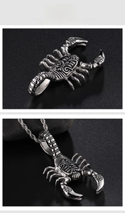 Detailed view of scorpion pendant with relief texture and vintage silver twisted chain