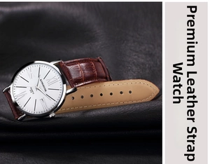 Close-up of white quartz dial with Roman numerals and brown crocodile leather strap