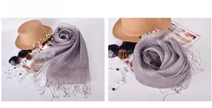 Silver silk organza shawl with metallic luster and long fringe details for evening wear