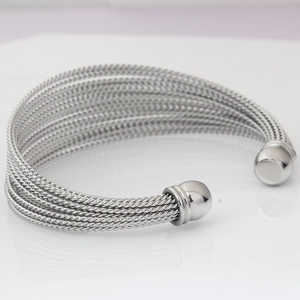 Macro shot of twisted stainless steel cable bracelet with spherical open-end details