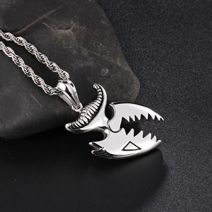 Polished stainless steel crocodile teeth necklace for men on natural stone display