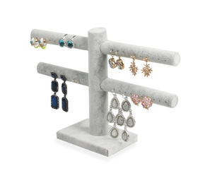 Detailed side view of a gray velvet double-tier T-bar jewelry display for earrings