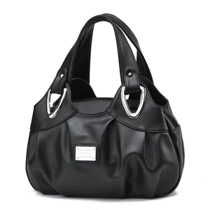 Detailed view of black pleated PU leather handbag with elegant silver metal logo plate